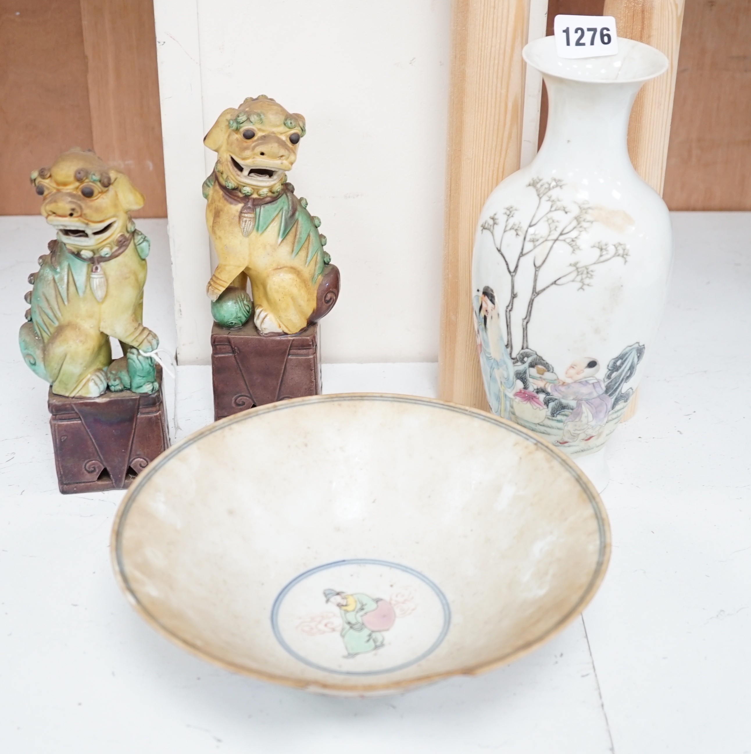 A pair of Chinese sancai lion dogs, together with a Chinese Republic period famille rose vase and bowl